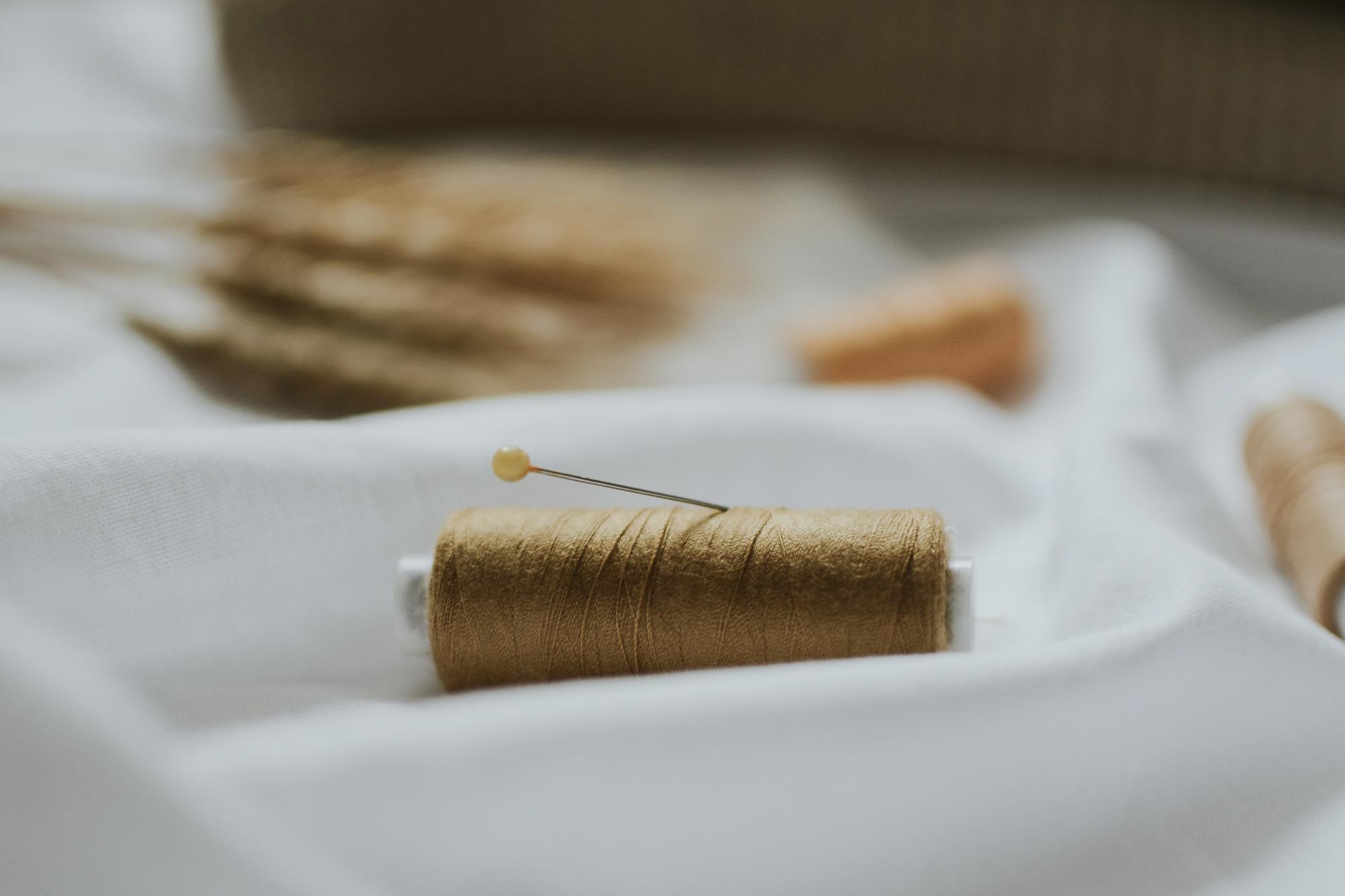 detailed embroidery on linen with gold threads